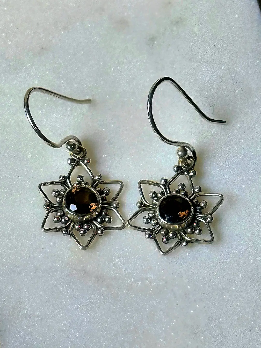 Tara oxidised silver eight-pointed star drop earrings with smoky quartz centre stones